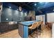 Stylish kitchenette featuring a kitchen island with bar stool seating, modern appliances, and tile backsplash at 1431 Waterford Green Dr, Marietta, GA 30068