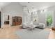Bright living room with a high ceiling, hardwood floors, and open access to kitchen and dining spaces at 1431 Waterford Green Dr, Marietta, GA 30068