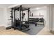 Finished basement featuring gym equipment and ample storage, creating a versatile space at 1598 Olympian Sw Cir, Atlanta, GA 30310