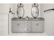 Stylish bathroom with double vanity, granite countertops, and modern fixtures at 1598 Olympian Sw Cir, Atlanta, GA 30310