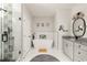 Elegant bathroom with a modern freestanding tub, glass shower, and sleek vanity at 1598 Olympian Sw Cir, Atlanta, GA 30310