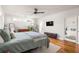 Cozy bedroom with hardwood floors, modern furnishings, and ample natural light at 1598 Olympian Sw Cir, Atlanta, GA 30310