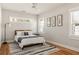 Bedroom featuring natural light and hardwood flooring at 1598 Olympian Sw Cir, Atlanta, GA 30310