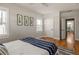 Cozy bedroom with hardwood floors, natural light, and neutral decor creates a relaxing atmosphere at 1598 Olympian Sw Cir, Atlanta, GA 30310