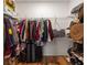 Organized walk-in closet with ample storage for clothes, shoes, and luggage at 1598 Olympian Sw Cir, Atlanta, GA 30310