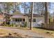 Charming bungalow with a covered front porch and a beautifully landscaped yard at 1598 Olympian Sw Cir, Atlanta, GA 30310