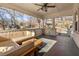 Inviting front porch featuring a comfortable seating area with an outdoor ceiling fan at 1598 Olympian Sw Cir, Atlanta, GA 30310