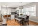 Modern kitchen with stainless appliances, granite countertops, and a bright dining area at 1598 Olympian Sw Cir, Atlanta, GA 30310