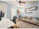 Comfortable office space with a modern desk, cozy couch, and unique cat climbing fixtures at 1598 Olympian Sw Cir, Atlanta, GA 30310