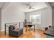 Open office area with hardwood floors, a comfortable chair, and natural light at 1598 Olympian Sw Cir, Atlanta, GA 30310