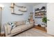 Comfortable office space with a modern desk, cozy couch, and unique cat climbing fixtures at 1598 Olympian Sw Cir, Atlanta, GA 30310