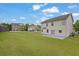 Large backyard featuring a patio and a grassy area, perfect for outdoor activities at 209 Woodmill Sw Way, Atlanta, GA 30331