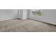 Bedroom with gray walls, plush carpeting, and large windows letting in natural light at 209 Woodmill Sw Way, Atlanta, GA 30331