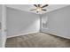 Neutral bedroom with carpet, ceiling fan and window letting in natural light at 209 Woodmill Sw Way, Atlanta, GA 30331