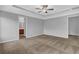 Bright bedroom with neutral paint, plush carpeting, and attached bath visible through the doorway at 209 Woodmill Sw Way, Atlanta, GA 30331