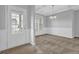 Dining room with gray walls, carpet, and a decorative chandelier at 209 Woodmill Sw Way, Atlanta, GA 30331