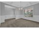 Dining room features gray walls, detailed wainscoting, and decorative chandelier at 209 Woodmill Sw Way, Atlanta, GA 30331