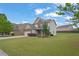 Two-story home on a corner lot with well-manicured lawn at 209 Woodmill Sw Way, Atlanta, GA 30331