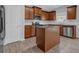 Well-lit kitchen features stainless steel appliances, an island, granite countertops and light gray walls at 209 Woodmill Sw Way, Atlanta, GA 30331