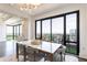 Elegant dining room with a modern table, balcony access, and city views, perfect for entertaining guests at 3475 Oak Valley Ne Rd # 2940, Atlanta, GA 30326