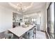 Elegant dining room with modern lighting fixtures, table setting and great view at 3475 Oak Valley Ne Rd # 2940, Atlanta, GA 30326
