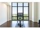 Bright exercise room featuring floor to ceiling windows offering natural light and serene views of the outdoors at 3475 Oak Valley Ne Rd # 2940, Atlanta, GA 30326