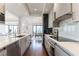 Modern kitchen with stainless steel appliances, sleek cabinets, and an open layout connecting to the dining area at 3475 Oak Valley Ne Rd # 2940, Atlanta, GA 30326
