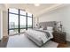 Serene bedroom features large windows with city views and elegant furnishings at 3475 Oak Valley Ne Rd # 2940, Atlanta, GA 30326