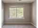 A cozy bedroom with neutral carpet and trim awaits your personal touches and style at 4995 Panola Mill Dr, Lithonia, GA 30038