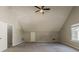 Large bedroom with high ceilings, carpeted floors, and a fan, providing ample space and comfort at 4995 Panola Mill Dr, Lithonia, GA 30038