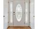 Elegant front door featuring decorative glass and sidelights, adding a touch of sophistication at 4995 Panola Mill Dr, Lithonia, GA 30038
