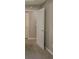 A hallway with carpeted floor connects rooms in this home at 4995 Panola Mill Dr, Lithonia, GA 30038