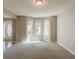 Bright living room featuring a bay window that floods the space with natural light at 4995 Panola Mill Dr, Lithonia, GA 30038