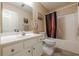 Bathroom features a vanity sink and a shower with tub combo at 5045 Edinborough Pl, Sugar Hill, GA 30518