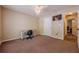 This bedroom features neutral walls, brown carpet, ceiling fan, and desk at 5045 Edinborough Pl, Sugar Hill, GA 30518