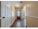 Bright foyer featuring hardwood floors and a decorative front door, creating a warm welcome at 5045 Edinborough Pl, Sugar Hill, GA 30518