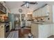 Charming kitchen with granite countertops, stainless steel appliances, and a breakfast bar at 5045 Edinborough Pl, Sugar Hill, GA 30518