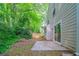 A verdant backyard with a concrete patio, perfect for outdoor relaxation at 744 Brittany Ct, Stone Mountain, GA 30083