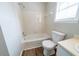 Cozy bathroom with a white toilet and a clean, tiled shower-over-tub at 744 Brittany Ct, Stone Mountain, GA 30083