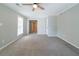 Spacious, light-filled bedroom with plush carpeting and neutral paint, offering a comfortable retreat at 744 Brittany Ct, Stone Mountain, GA 30083