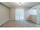 Large space for dining with large sliding glass doors at 744 Brittany Ct, Stone Mountain, GA 30083