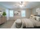 Inviting bedroom suite with natural light and modern decor and plush carpet for comfort at 744 Brittany Ct, Stone Mountain, GA 30083