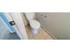This powder room features tile flooring, a toilet and access to another room at 744 Brittany Ct, Stone Mountain, GA 30083