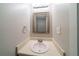 This powder room has an ornate framed mirror and updated fixtures at 744 Brittany Ct, Stone Mountain, GA 30083