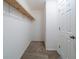 Empty walk-in closet featuring neutral carpet and a shelf at 744 Brittany Ct, Stone Mountain, GA 30083