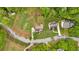 Aerial view showcases the home with a deck, surrounding trees, and neighborhood streets at 2480 Ashbourne Dr, Lawrenceville, GA 30043