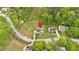 An aerial view of a home with a lush, green lawn, landscaping, and mature trees in a desirable neighborhood at 2480 Ashbourne Dr, Lawrenceville, GA 30043