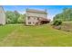 Expansive backyard featuring lush green lawn and a wooden deck perfect for outdoor gatherings at 2480 Ashbourne Dr, Lawrenceville, GA 30043