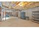 An unfinished basement with an exposed ceiling and a concrete floor at 2480 Ashbourne Dr, Lawrenceville, GA 30043