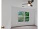 Bright bedroom with a ceiling fan and a large window offering outdoor views at 2480 Ashbourne Dr, Lawrenceville, GA 30043